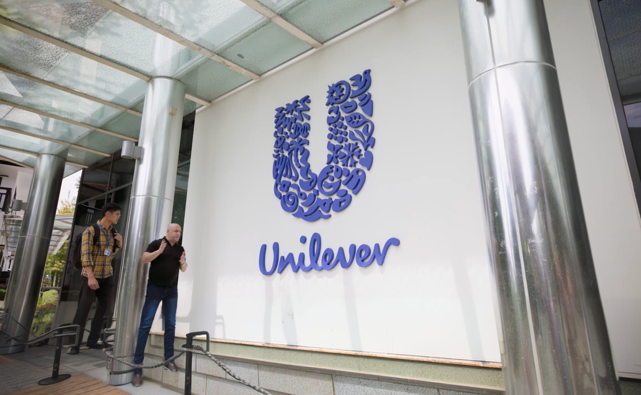 Customer testimonial background — Unilever office entrance